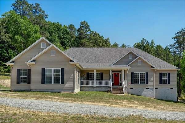 6.45 Acres of Land with Home for Sale in Gibsonville, North Carolina