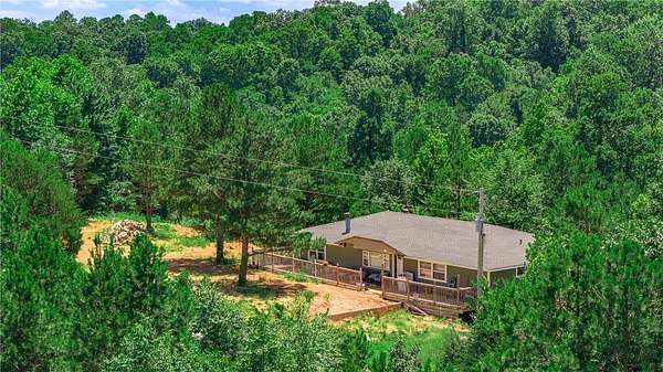 5 Acres of Land with Home for Sale in Pineville, Missouri