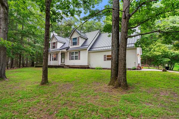 2 Acres of Land with Home for Sale in Indian River, Michigan