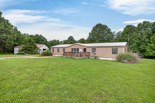 56.6 Acres of Recreational Land with Home for Sale in Hartville, Missouri