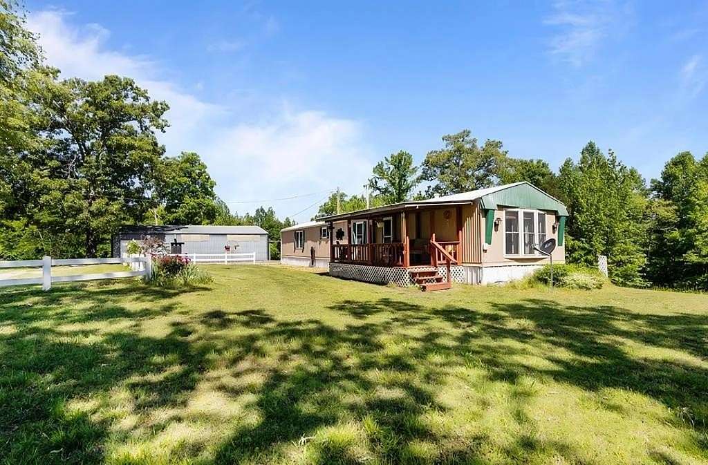 31 Acres of Recreational Land with Home for Sale in Camden, Tennessee