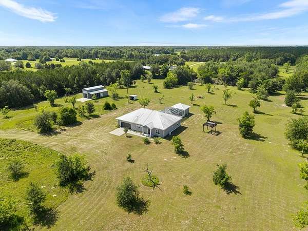 10 Acres of Recreational Land with Home for Sale in Chiefland, Florida