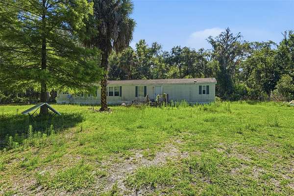 6.26 Acres of Land with Home for Sale in Citra, Florida