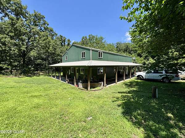 20.6 Acres of Recreational Land with Home for Sale in Goodman, Missouri