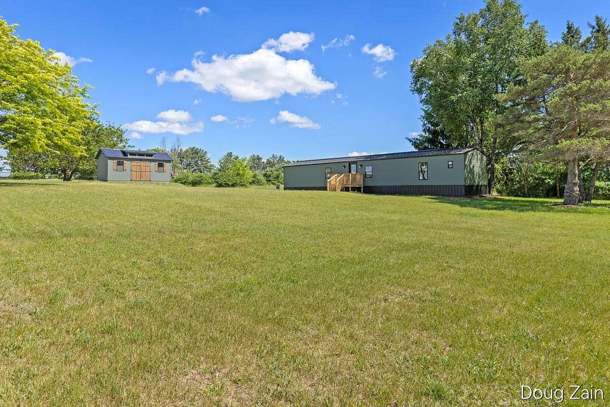 2.57 Acres of Land with Home for Sale in Six Lakes, Michigan