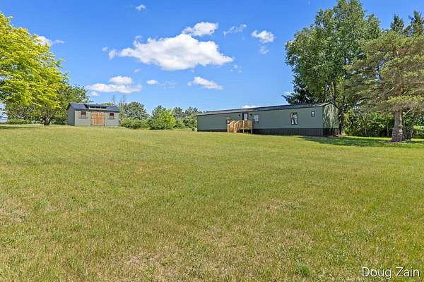 2.57 Acres of Land with Home for Sale in Six Lakes, Michigan