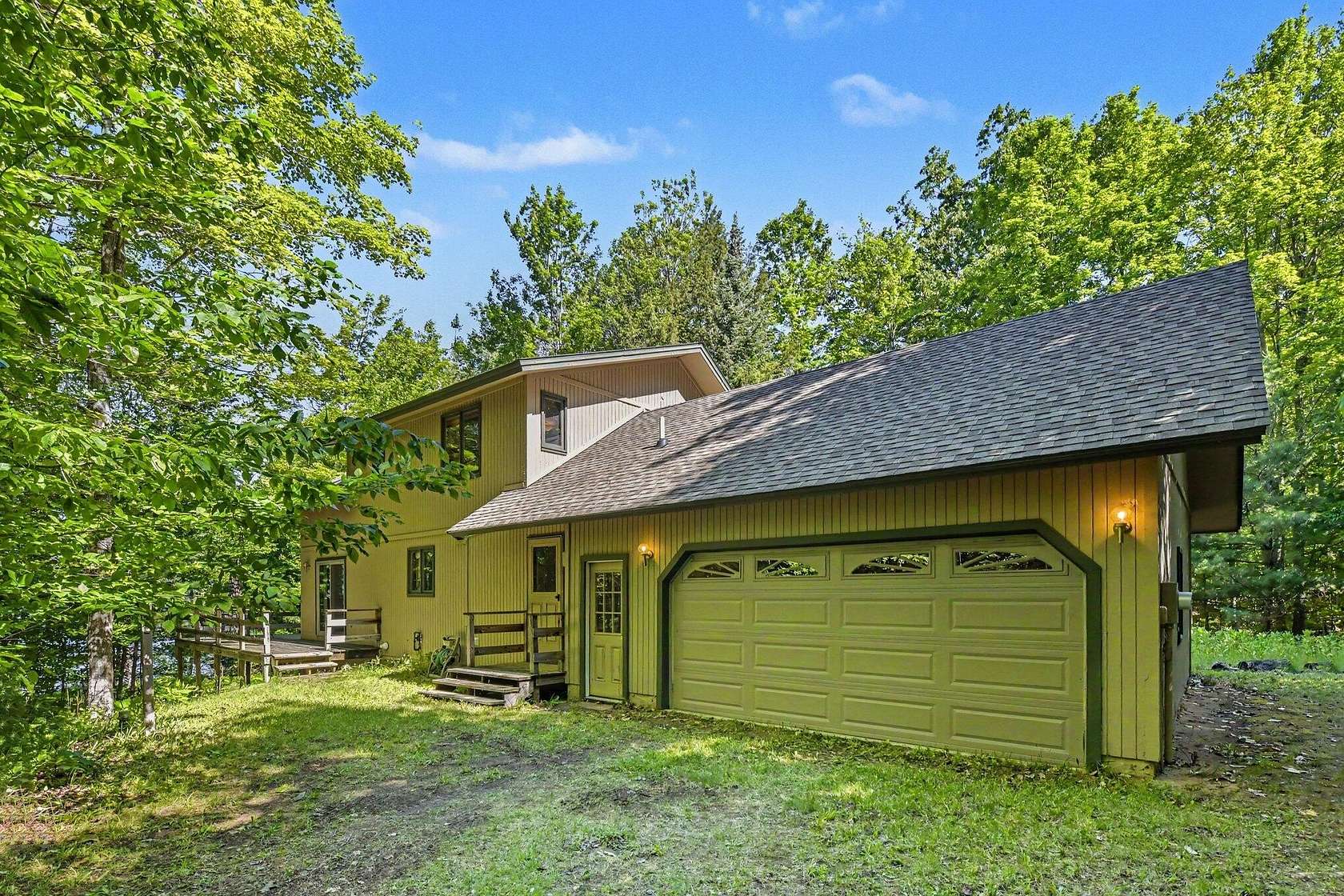 11.4 Acres of Recreational Land with Home for Sale in Indian River, Michigan