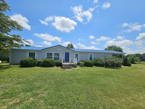 9.76 Acres of Land with Home for Sale in Phillipsburg, Missouri