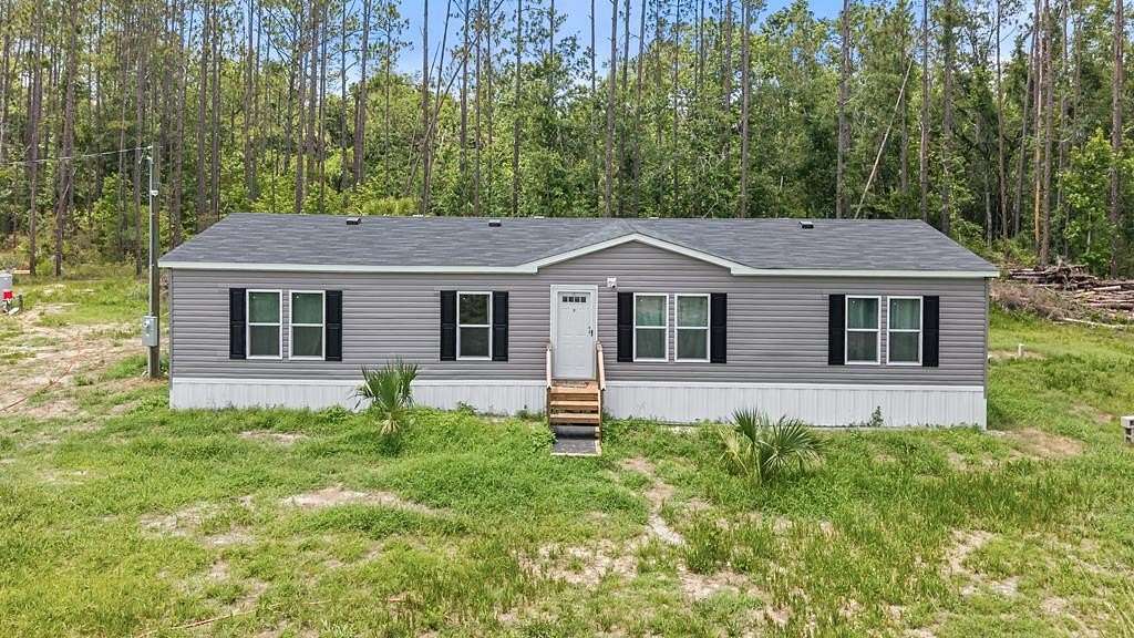 10.1 Acres of Recreational Land with Home for Sale in Jena, Florida