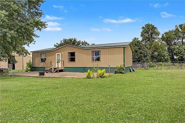 8.54 Acres of Land with Home for Sale in Gravette, Arkansas