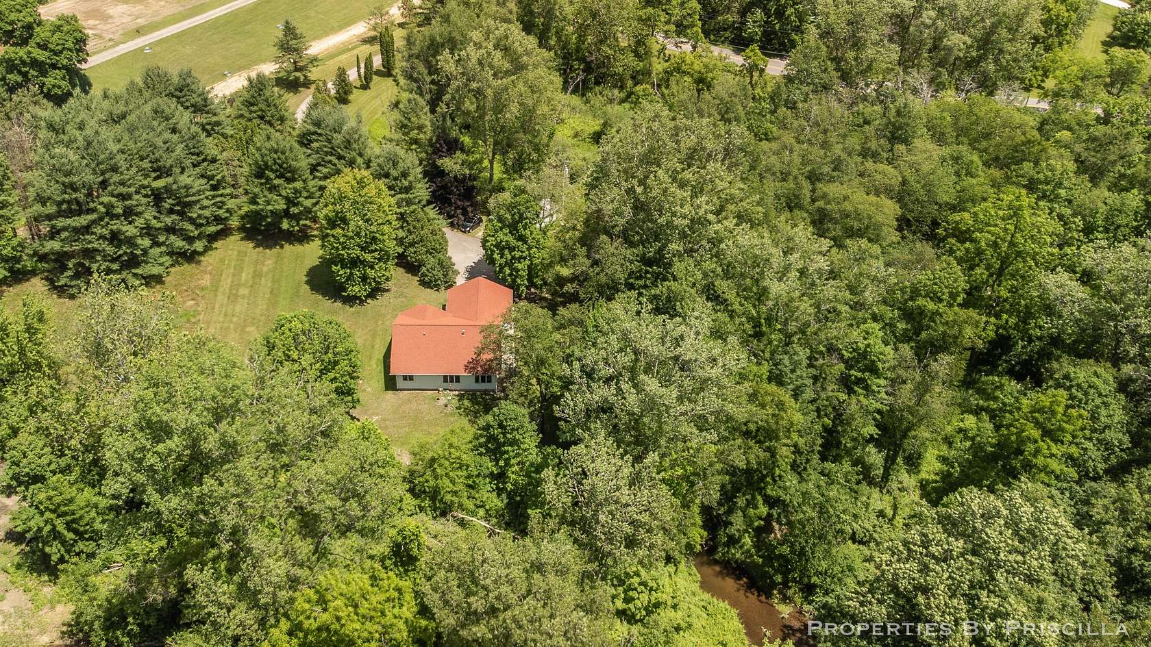 6 Acres of Land with Home for Sale in Comstock Park, Michigan