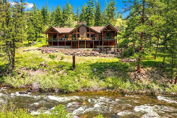 4.83 Acres of Land with Home for Sale in Seeley Lake, Montana