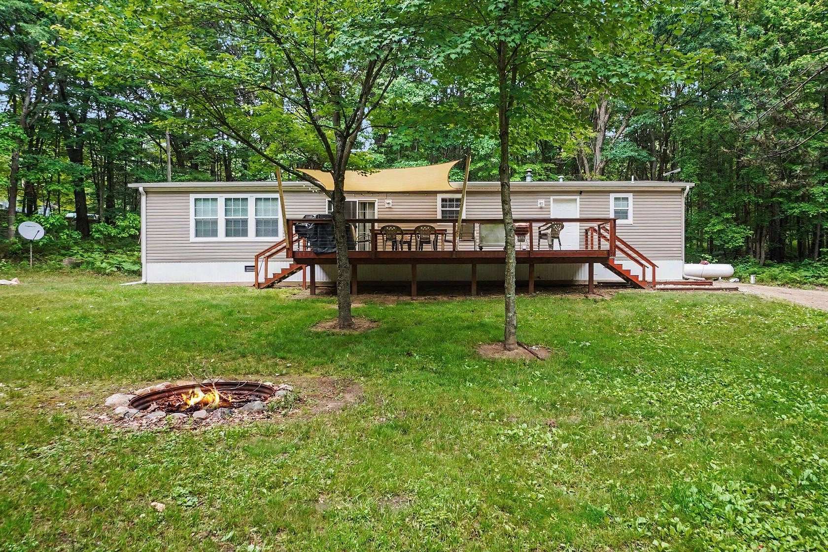30 Acres of Recreational Land with Home for Sale in Chase, Michigan