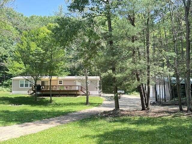 30 Acres of Recreational Land with Home for Sale in Chase, Michigan