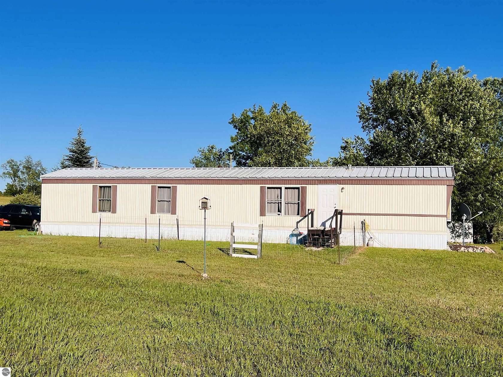 9.84 Acres of Land with Home for Sale in Evart, Michigan