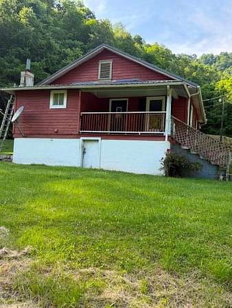 65 Acres of Land with Home for Sale in Phyllis, Kentucky