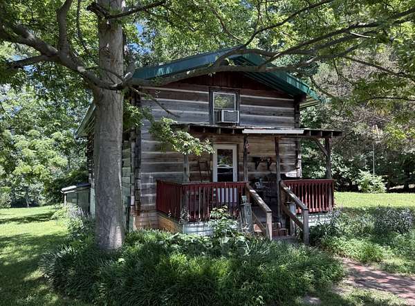5.15 Acres of Land with Home for Auction in Cross Plains, Tennessee