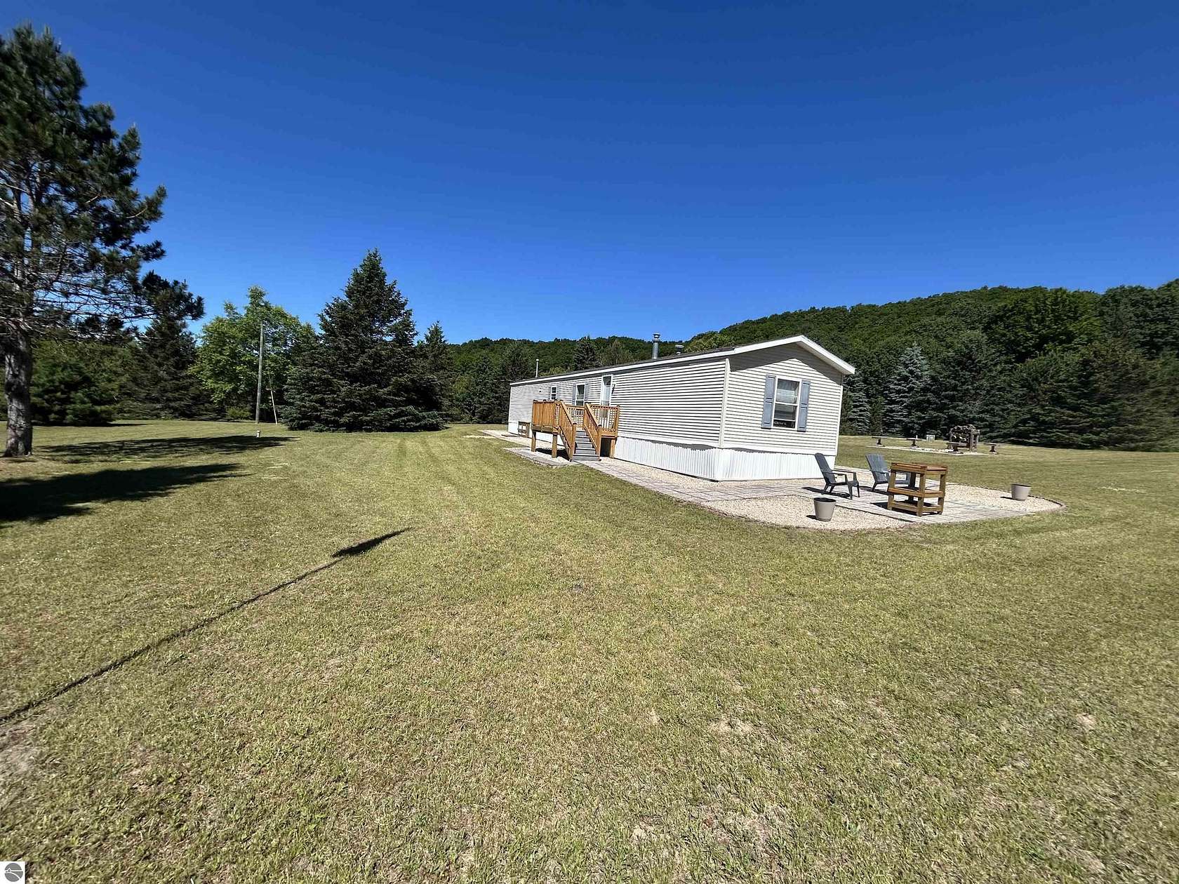 20 Acres of Recreational Land with Home for Sale in Mancelona, Michigan