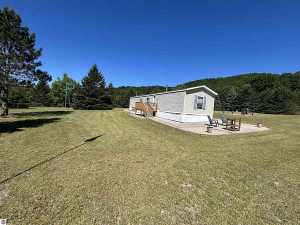 20 Acres of Recreational Land with Home for Sale in Mancelona, Michigan