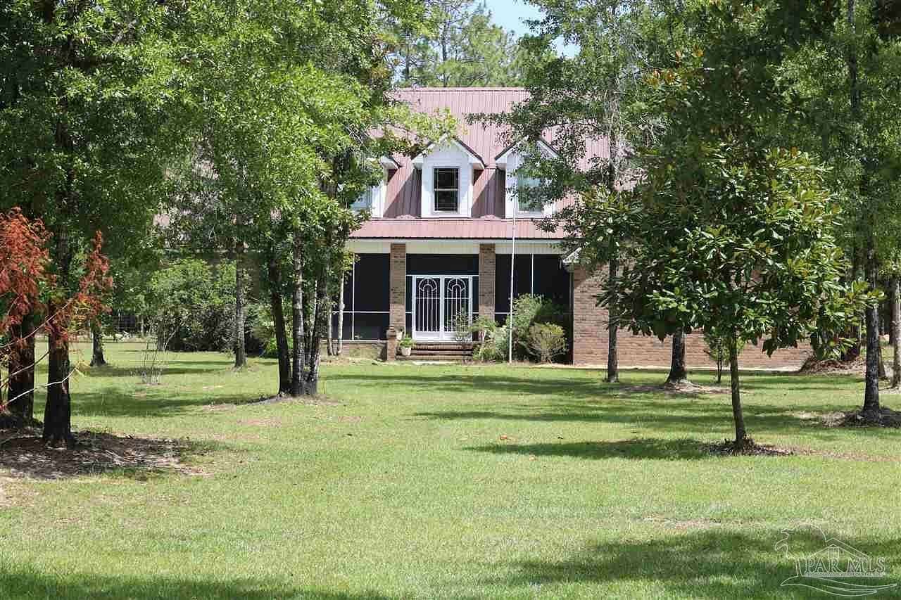4.75 Acres of Land with Home for Sale in Milton, Florida