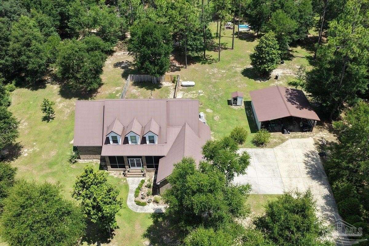 4.75 Acres of Land with Home for Sale in Milton, Florida
