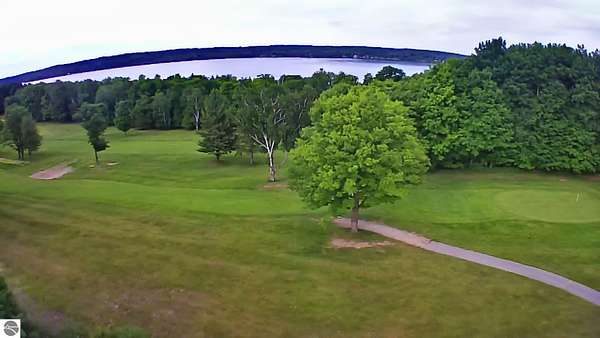 0.65 Acres of Residential Land for Sale in Kewadin, Michigan