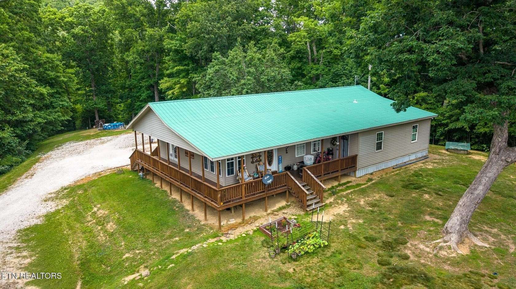 5.2 Acres of Land with Home for Sale in Pioneer, Tennessee