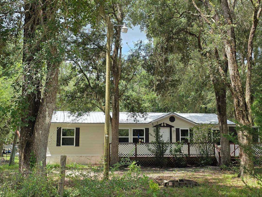 6.4 Acres of Land with Home for Sale in Perry, Florida