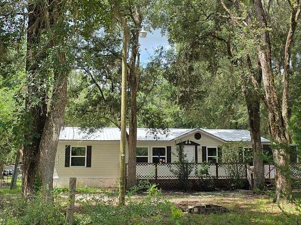 6.4 Acres of Land with Home for Sale in Perry, Florida