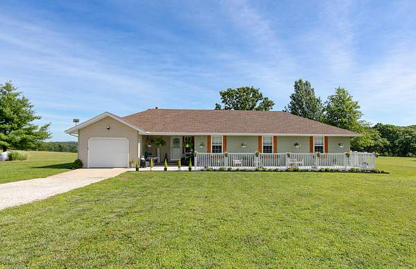 9.73 Acres of Land with Home for Sale in Bois D'Arc, Missouri