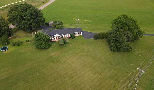 5.79 Acres of Land with Home for Sale in Paris, Tennessee