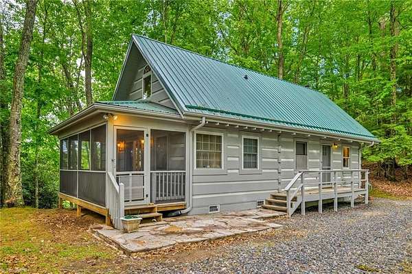 5.15 Acres of Land with Home for Sale in Lansing, North Carolina