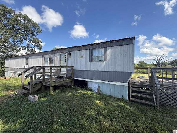 22.2 Acres of Land with Home for Sale in Mayfield, Kentucky