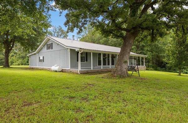 93.3 Acres of Agricultural Land with Home for Sale in Gilmer, Texas