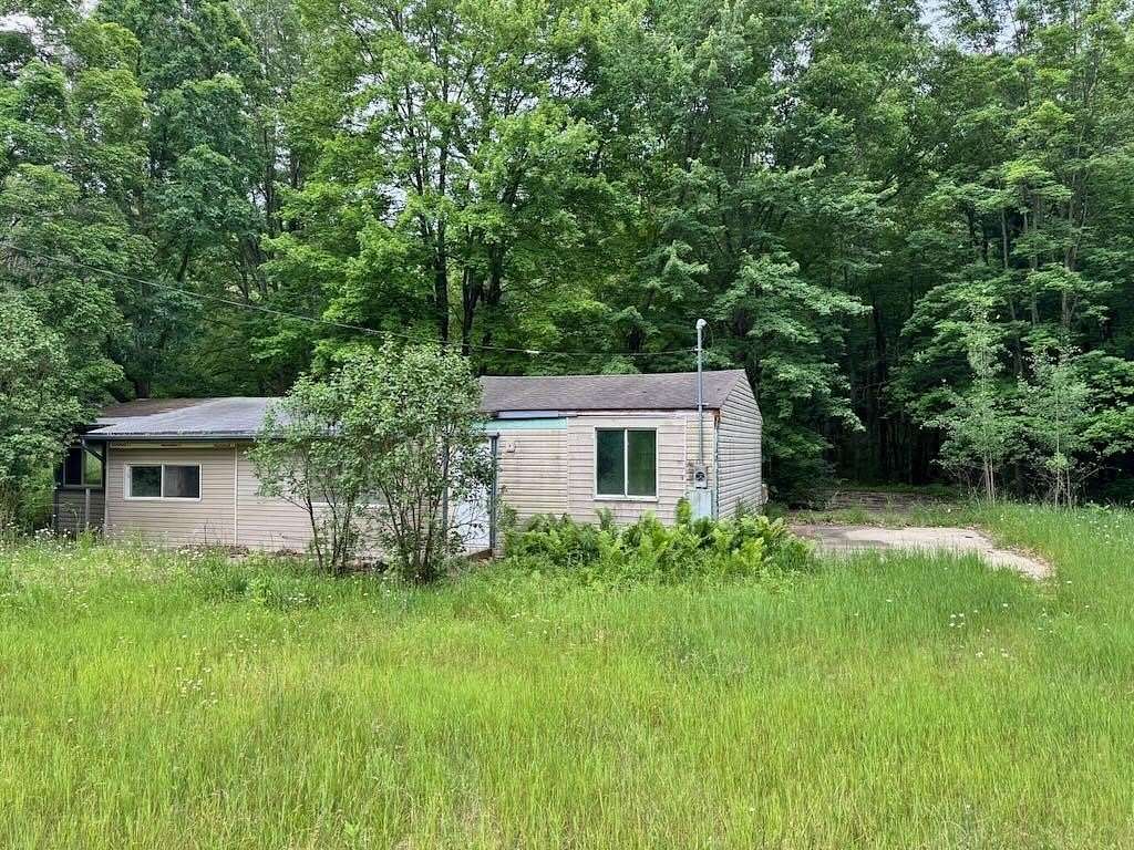 10 Acres of Recreational Land with Home for Sale in Lake, Michigan