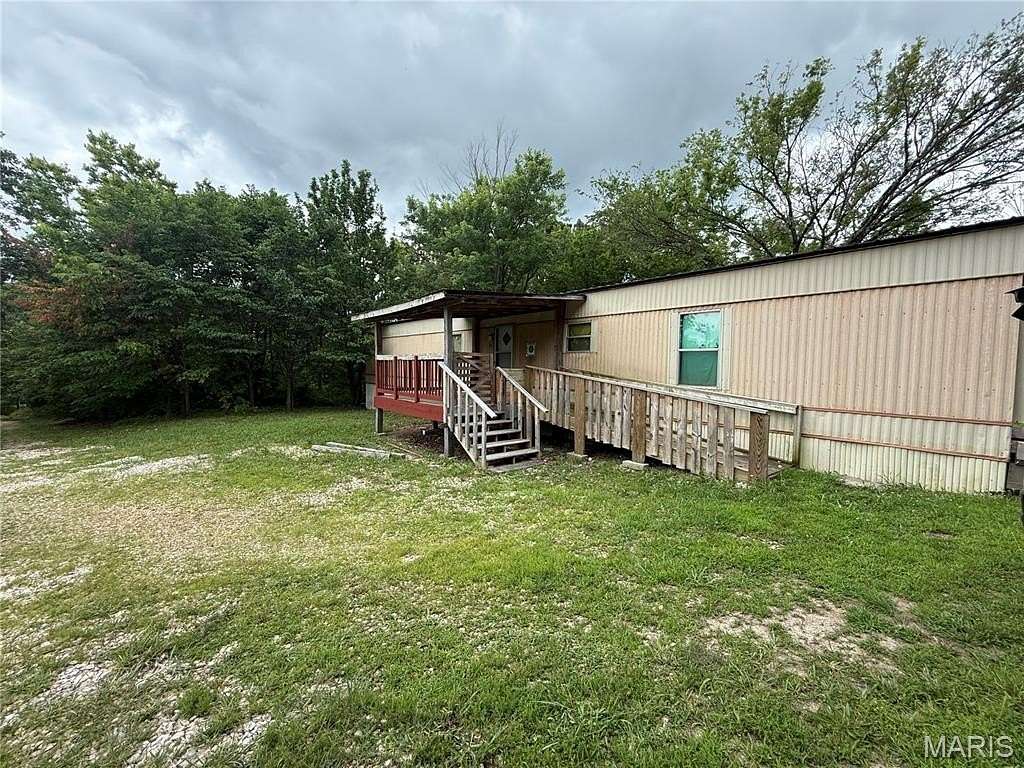 2.48 Acres of Land with Home for Sale in Laquey, Missouri