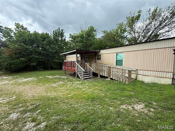 2.48 Acres of Land with Home for Sale in Laquey, Missouri