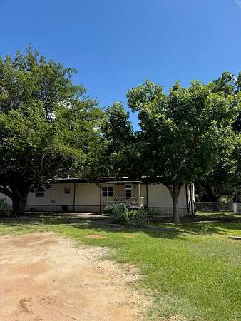 10 Acres of Recreational Land with Home for Sale in Hext, Texas