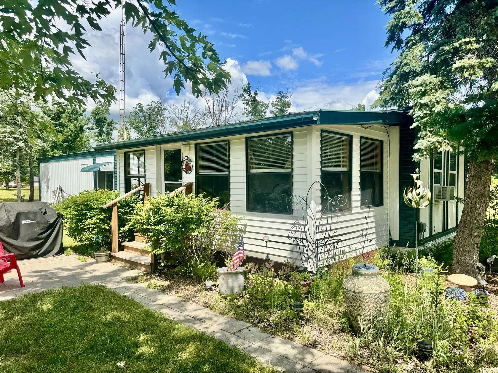 10 Acres of Recreational Land with Home for Sale in Comins, Michigan