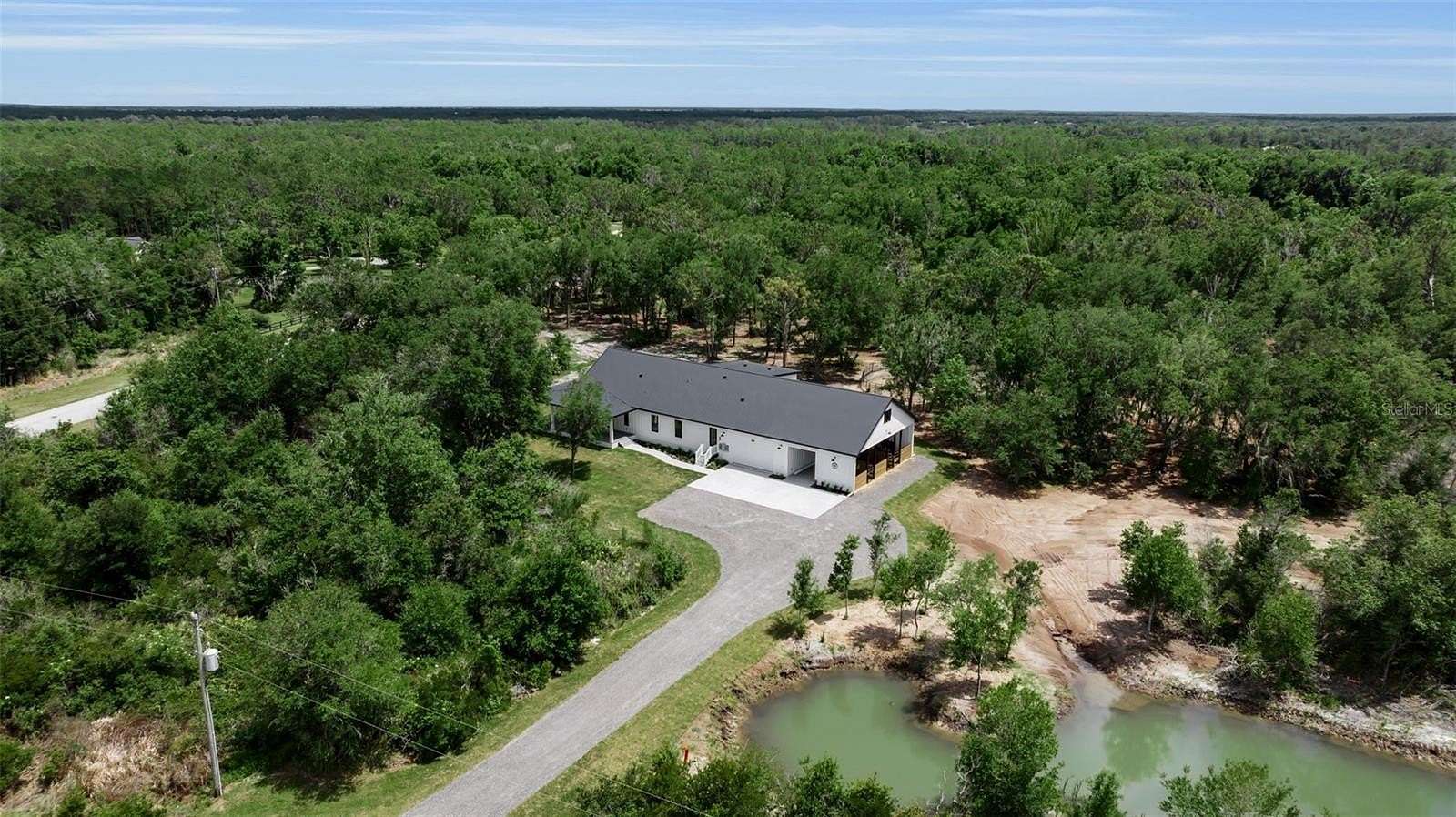 5.86 Acres of Land with Home for Sale in Myakka City, Florida
