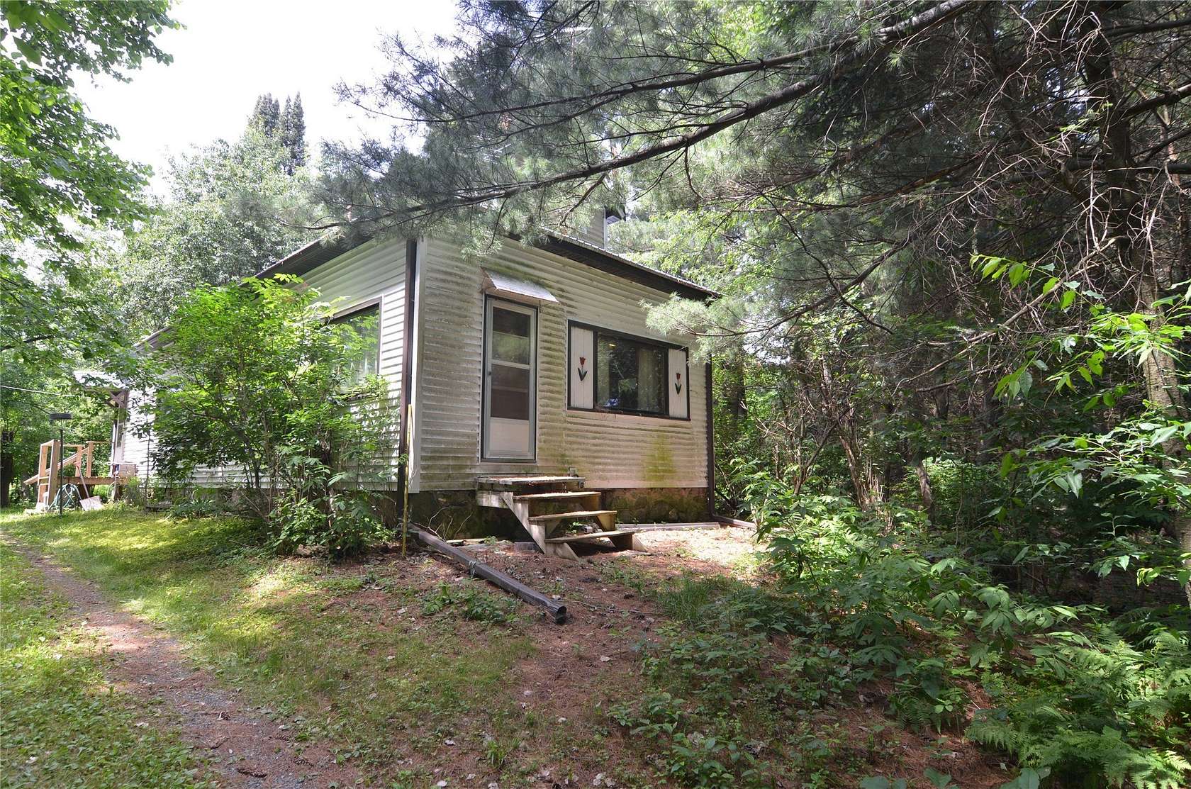 10 Acres of Recreational Land with Home for Sale in Withee, Wisconsin