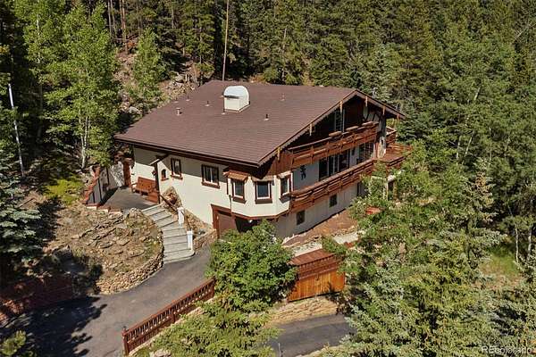 7.79 Acres of Land with Home for Sale in Evergreen, Colorado
