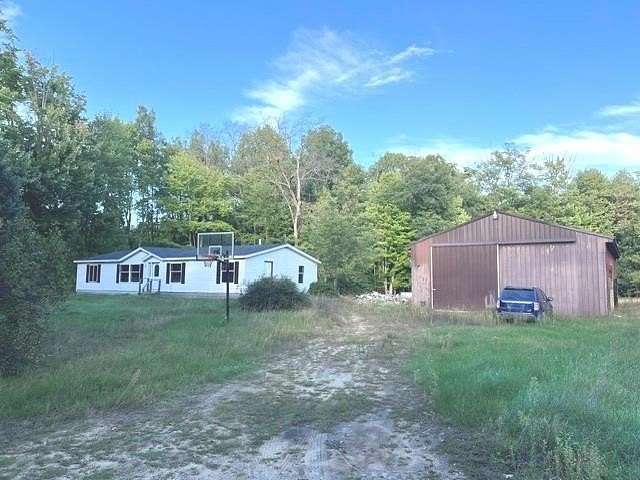 3.83 Acres of Land with Home for Sale in Harrison, Michigan