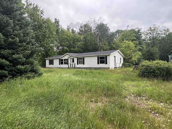 3.83 Acres of Land with Home for Sale in Harrison, Michigan