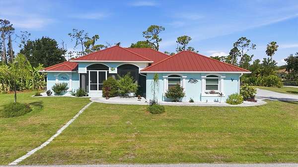 1.6 Acres of Land with Home for Sale in Port Charlotte, Florida