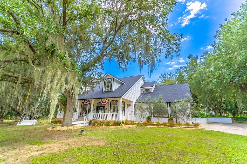 11.3 Acres of Land with Home for Auction in Umatilla, Florida