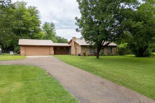 29.8 Acres of Land with Home for Sale in Ore City, Texas