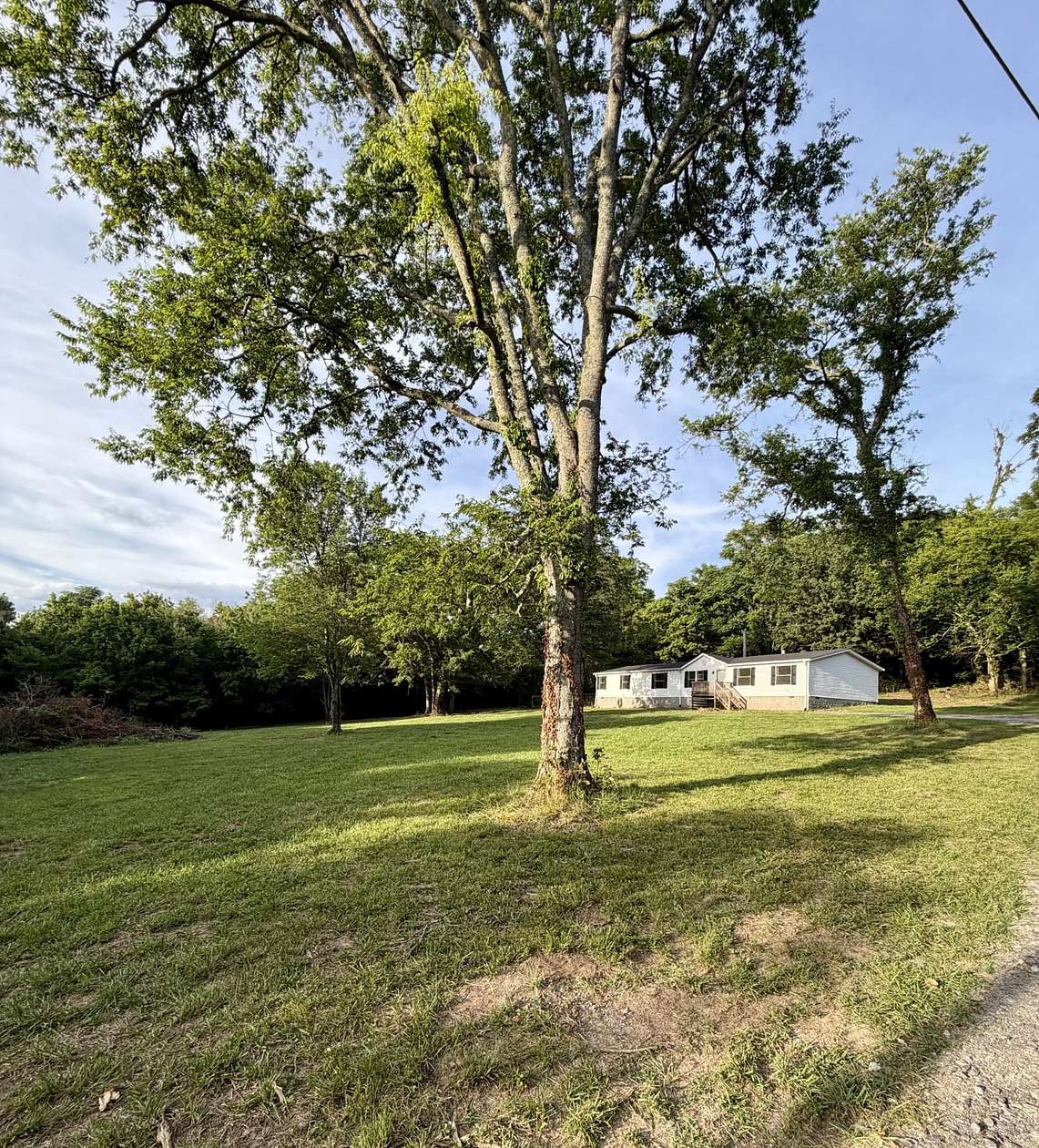 11.5 Acres of Land with Home for Sale in Brush Creek, Tennessee