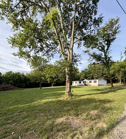 11.5 Acres of Land with Home for Sale in Brush Creek, Tennessee