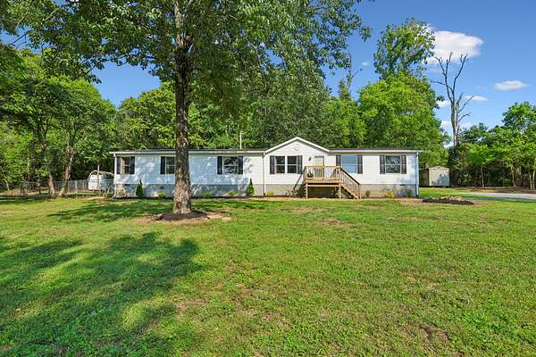 11.5 Acres of Land with Home for Sale in Brush Creek, Tennessee